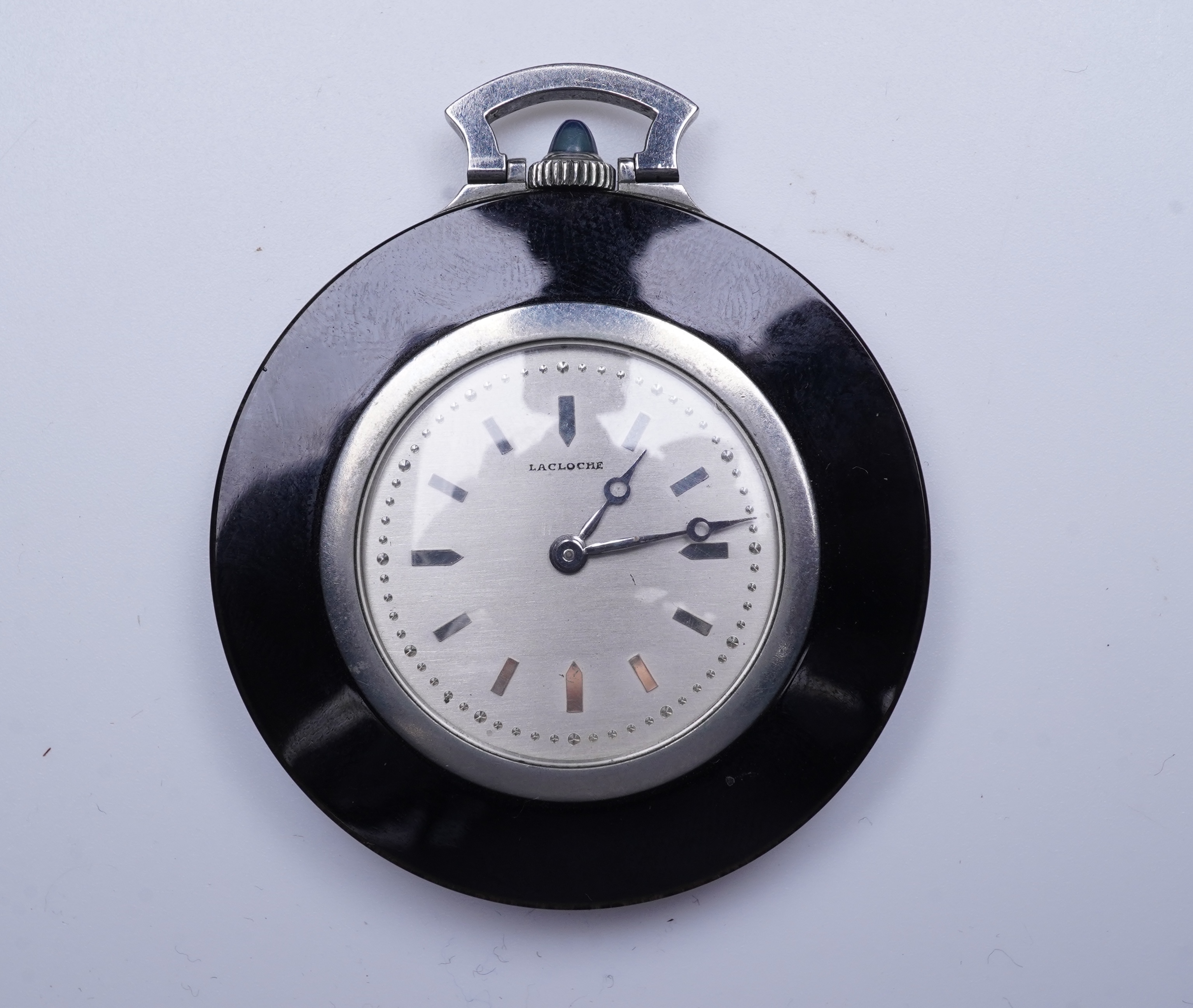 Lacloche Frères, an Art Deco onyx and sapphire pocket watch, circa 1925